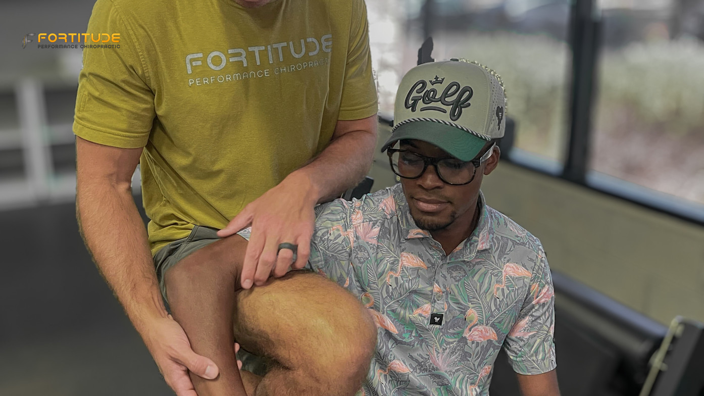  Patient being evaluated for elbow pain by performance chiropractor, highlighting Fortitude’s hands-on diagnostic approach.