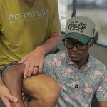  Patient being evaluated for elbow pain by performance chiropractor, highlighting Fortitude’s hands-on diagnostic approach.