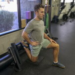 Lunge position with dumbbell and band resistance