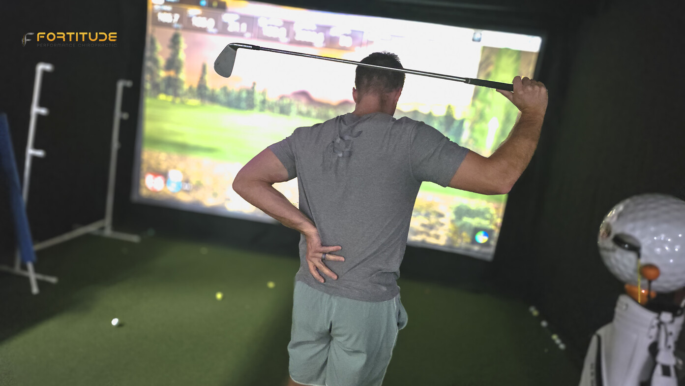 Golfer in Pain Holding Lower Back after Golf Swing