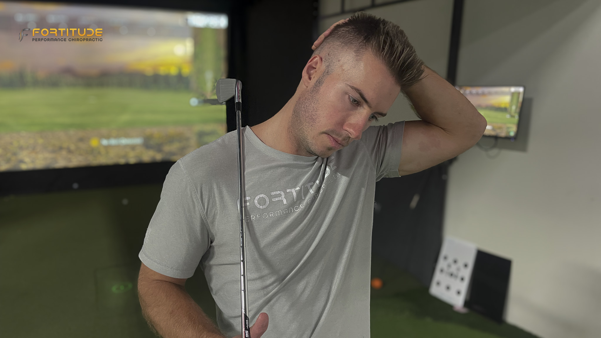 golfer gently stretching his neck to the side, an example of common stretches that provide temporary relief but don't always address the underlying cause of pain.